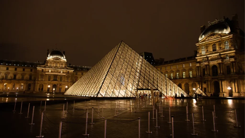 Louvre Pyramid at night in Paris, France